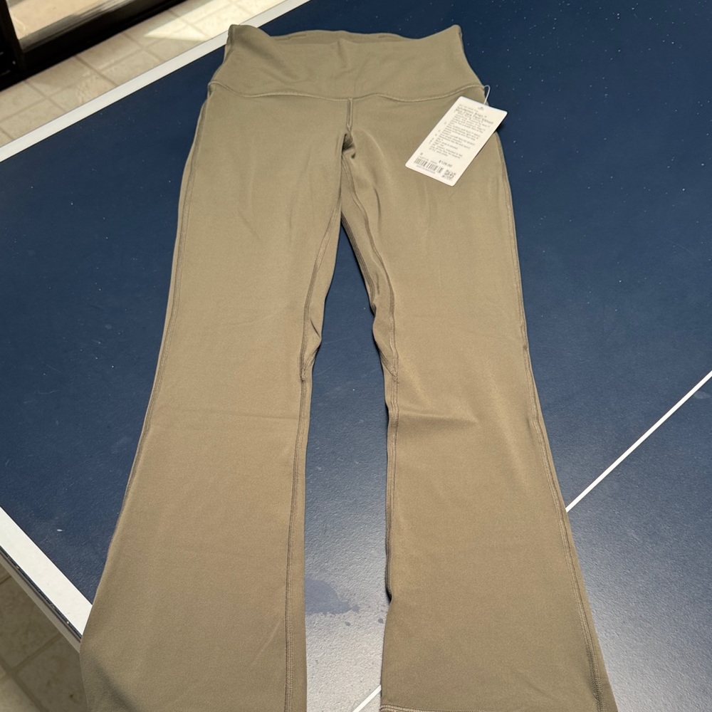 Lululemon new moss green flare leggings. 6